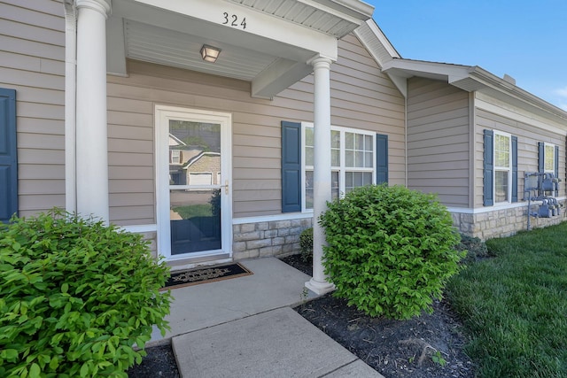 view of exterior entry with stone siding