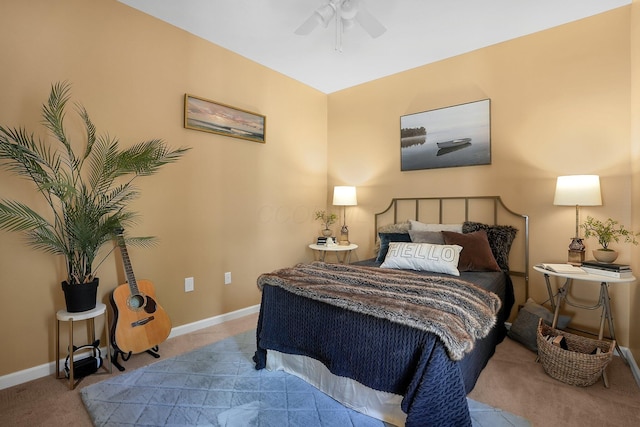 carpeted bedroom with a ceiling fan and baseboards