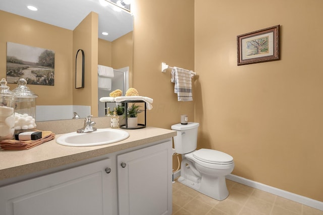 full bathroom featuring walk in shower, vanity, tile patterned floors, baseboards, and toilet