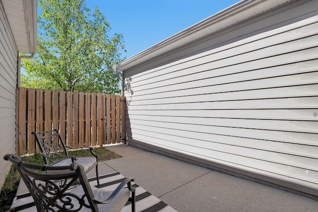 view of patio / terrace featuring fence