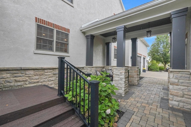 2443 Shepherd Ct, Powell, OH 43065 - doorway to property with stone siding and stucco siding