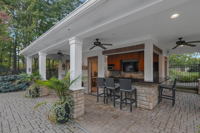 2443 Shepherd Ct, Powell, OH 43065 - view of patio featuring a ceiling fan and fence
