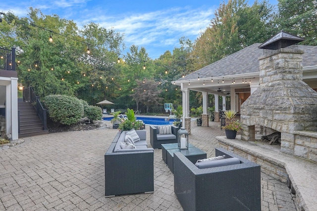 2443 Shepherd Ct, Powell, OH 43065 - view of patio featuring stairway, an outdoor living space with a fireplace, an outdoor pool, and a ceiling fan