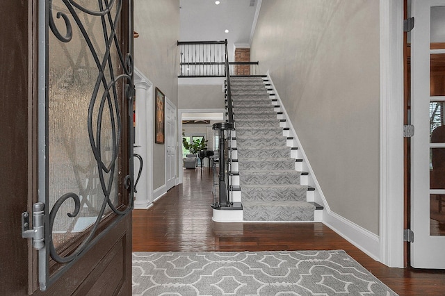 2443 Shepherd Ct, Powell, OH 43065 - entryway featuring wood finished floors, stairway, baseboards, and a towering ceiling