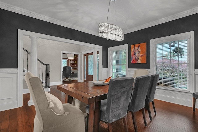 2443 Shepherd Ct, Powell, OH 43065 - dining area with ornamental molding, a chandelier, wood-type flooring, stairs, and a wainscoted wall