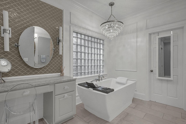 2443 Shepherd Ct, Powell, OH 43065 - bathroom featuring a soaking tub, crown molding, a chandelier, wallpapered walls, and baseboards
