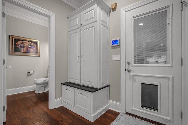 2443 Shepherd Ct, Powell, OH 43065 - mudroom featuring baseboards, dark wood-style flooring, and ornamental molding