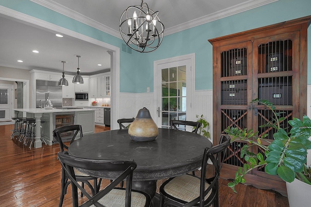 2443 Shepherd Ct, Powell, OH 43065 - dining space featuring a chandelier, wainscoting, beverage cooler, dark wood-style floors, and crown molding