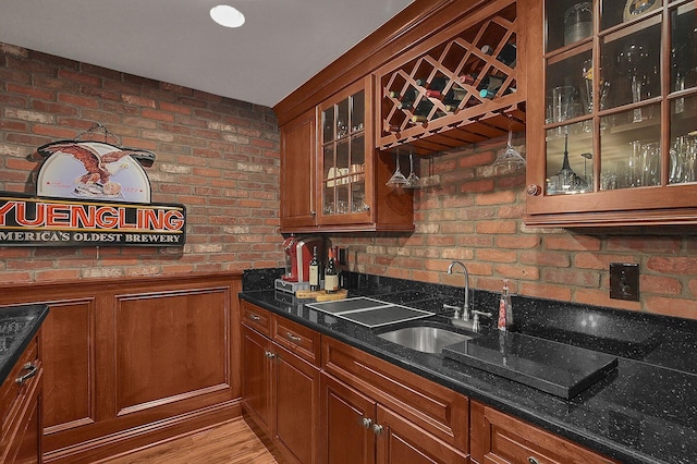 2443 Shepherd Ct, Powell, OH 43065 - indoor wet bar featuring wainscoting and brick wall