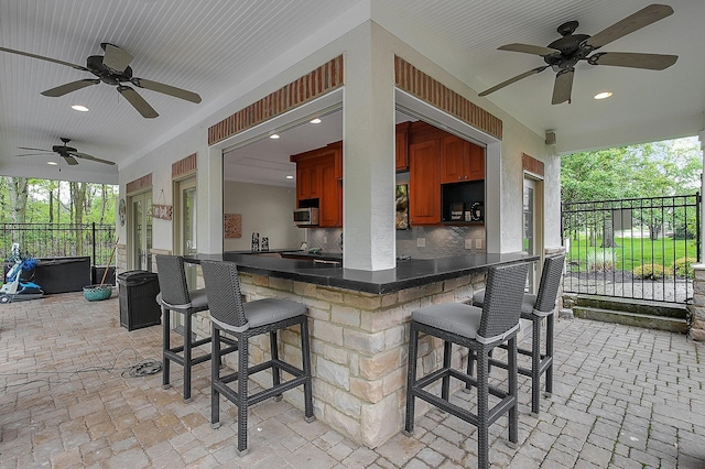 2443 Shepherd Ct, Powell, OH 43065 - view of patio / terrace with a ceiling fan and fence