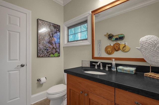2443 Shepherd Ct, Powell, OH 43065 - bathroom featuring ornamental molding, vanity, toilet, and baseboards