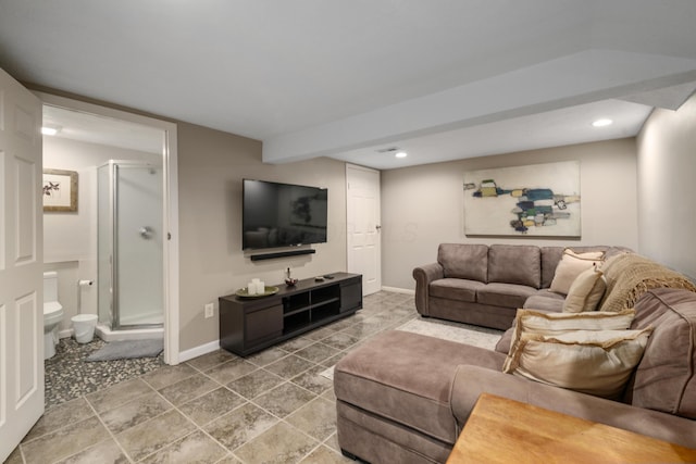 tiled living area with recessed lighting and baseboards