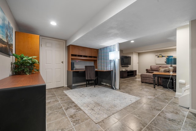 home office with baseboards, stone finish floor, and recessed lighting