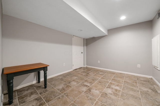 finished basement featuring recessed lighting and baseboards