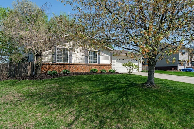 obstructed view of property featuring a front yard, driveway, brick siding, an attached garage, and fence