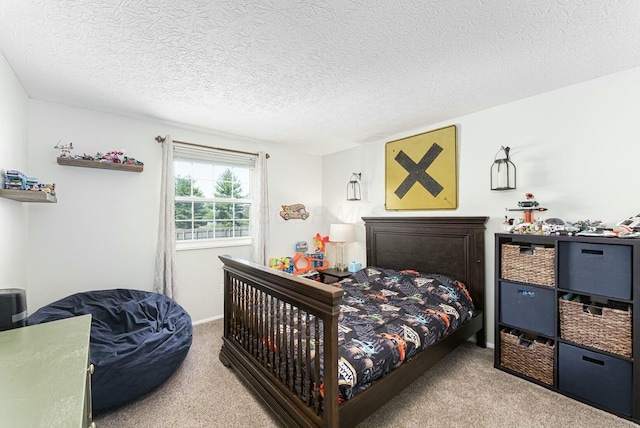 carpeted bedroom with a textured ceiling