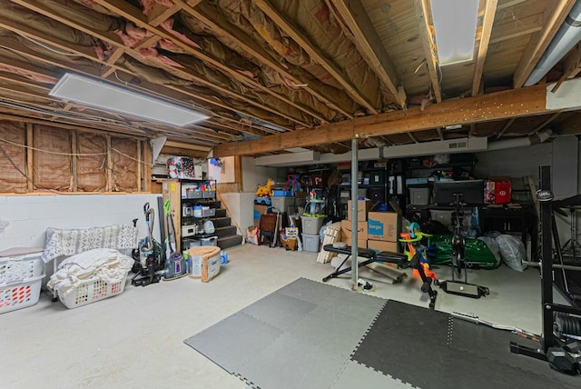 unfinished basement featuring stairs