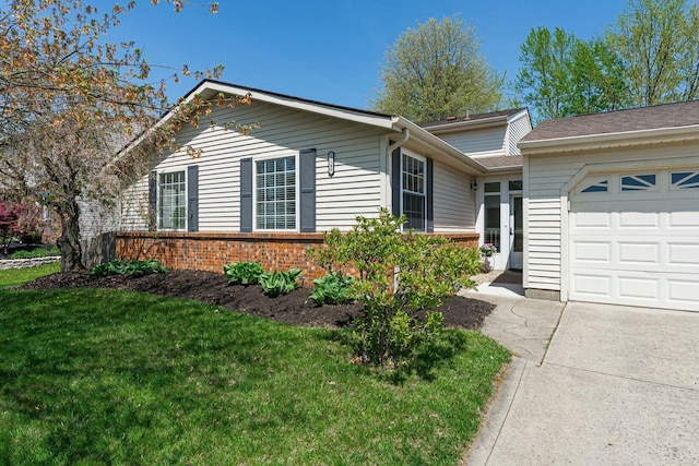 single story home featuring a garage, brick siding, french doors, and a front yard