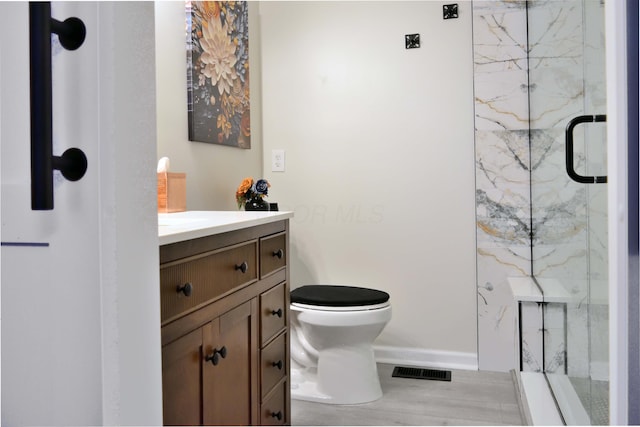 2651 Winningwillow Dr, Columbus, OH 43207 - full bathroom with a marble finish shower, vanity, toilet, and baseboards