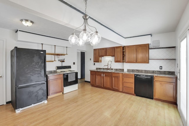 kitchen with brown cabinets, open shelves, light wood finished floors, and black appliances
