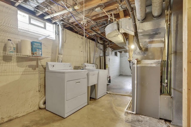 basement with washing machine and clothes dryer