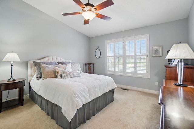 bedroom with light colored carpet, baseboards, and visible vents