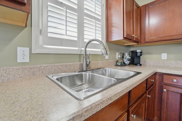 kitchen with light countertops and a sink