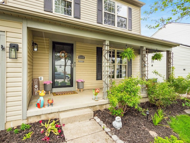 doorway to property featuring a porch