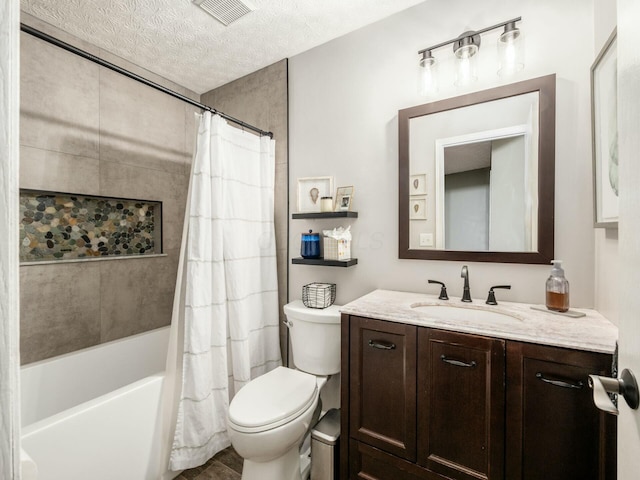 bathroom featuring vanity, shower / bath combination with curtain, toilet, visible vents, and a textured ceiling