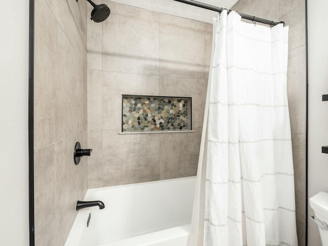 bathroom featuring shower / bathtub combination with curtain and toilet