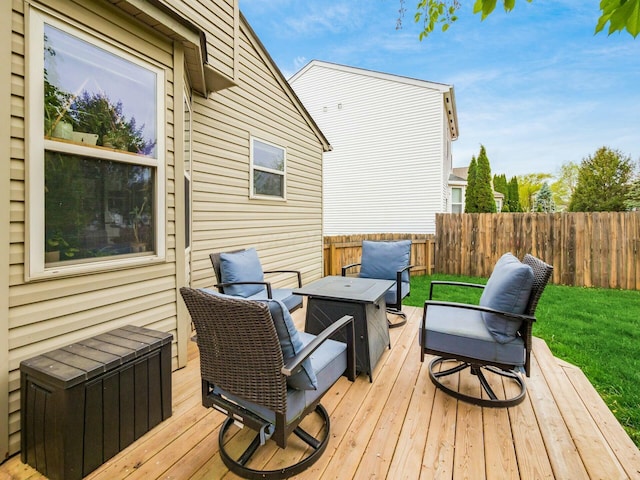 wooden terrace featuring fence and an outdoor fire pit
