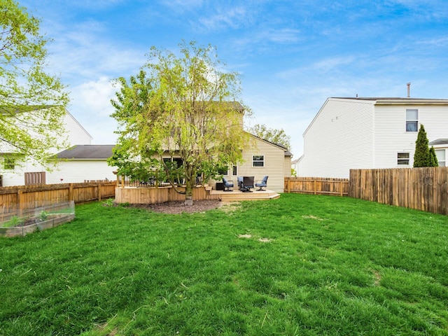 view of yard with a patio, a fenced backyard, outdoor lounge area, and a garden
