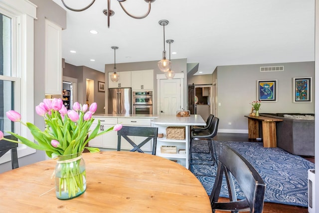 dining room featuring visible vents, recessed lighting, baseboards, and dark wood-style flooring