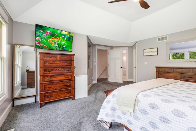 carpeted bedroom featuring baseboards, a ceiling fan, and visible vents