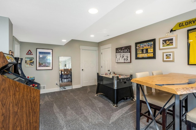 interior space featuring visible vents, recessed lighting, baseboards, and dark carpet