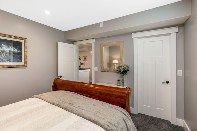 bedroom with recessed lighting, baseboards, and dark carpet