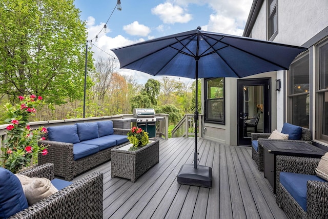 wooden deck featuring an outdoor hangout area and a grill