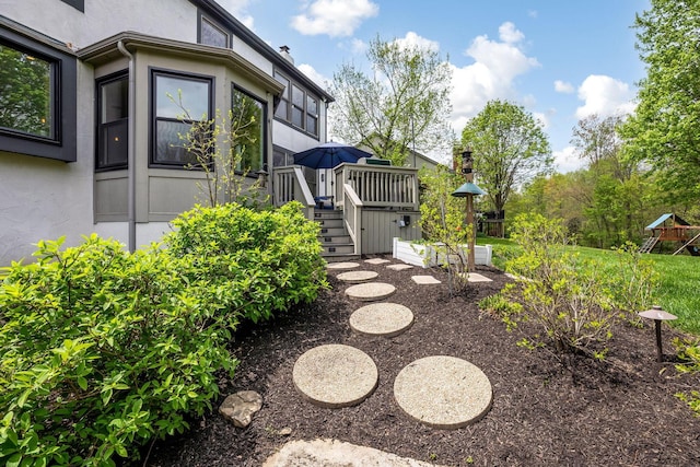 view of yard with stairway and a wooden deck