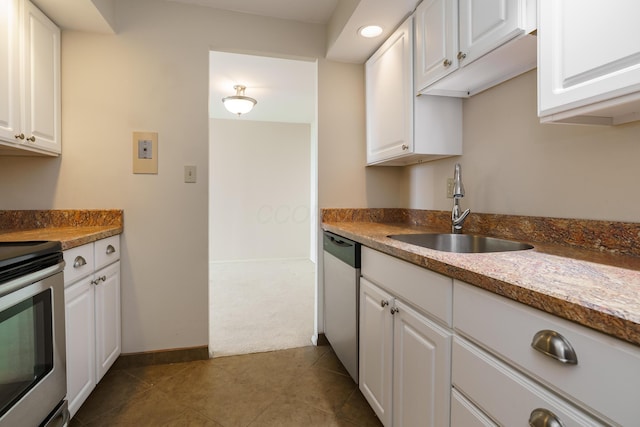 1000 Urlin Ave Unit 1407, Columbus, OH 43212 - kitchen featuring a sink, appliances with stainless steel finishes, white cabinets, and dark carpet