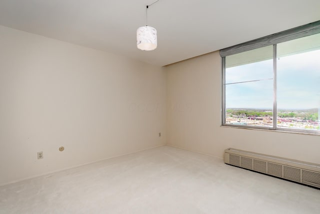 1000 Urlin Ave Unit 1407, Columbus, OH 43212 - spare room featuring carpet floors, a baseboard radiator, and a wealth of natural light