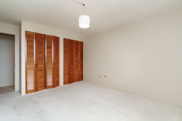 1000 Urlin Ave Unit 1407, Columbus, OH 43212 - unfurnished bedroom with carpet flooring and two closets