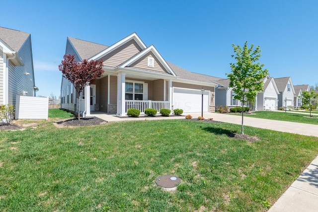 view of front of property with covered porch, an attached garage, driveway, and a front yard