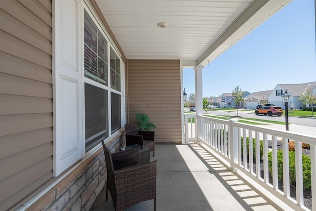 balcony with a residential view and covered porch