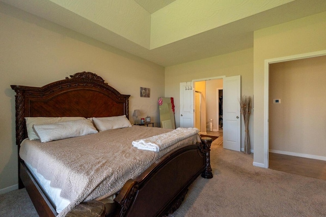 carpeted bedroom featuring baseboards