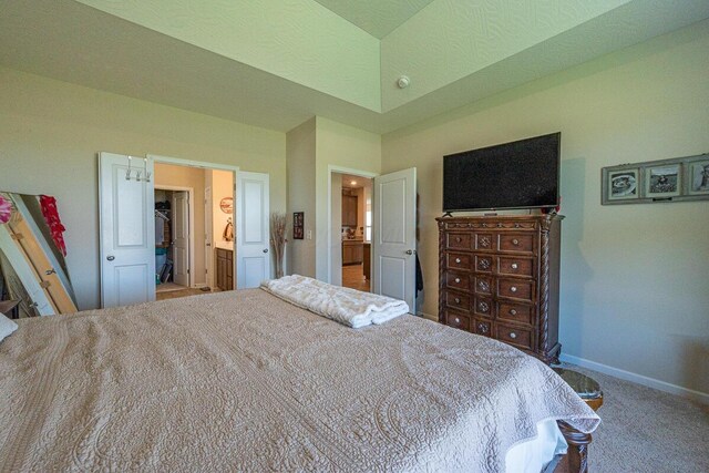 carpeted bedroom featuring baseboards