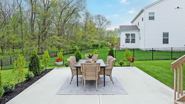 view of patio / terrace featuring outdoor dining space and a fenced backyard