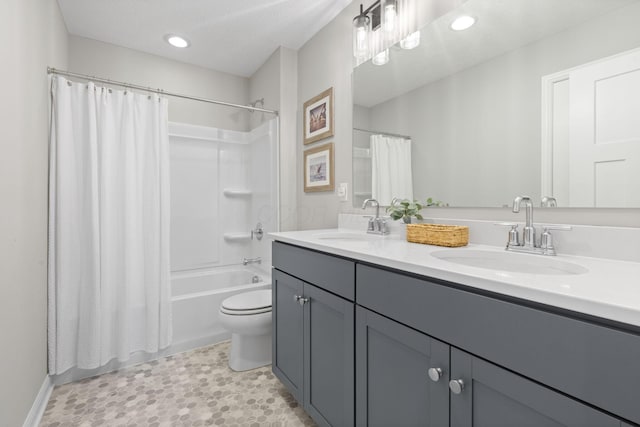 full bath with a sink, toilet, shower / bathtub combination with curtain, and double vanity