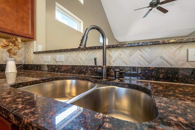 room details with brown cabinetry, a sink, decorative backsplash, and a ceiling fan