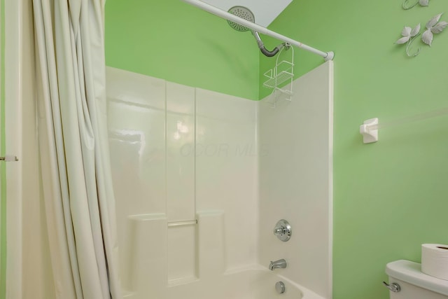 full bathroom featuring toilet and shower / bathtub combination with curtain