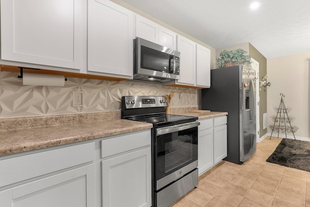 8573 Greengate Blvd Unit 41, Canal Winchester, OH 43110 - kitchen with white cabinets, appliances with stainless steel finishes, and light countertops